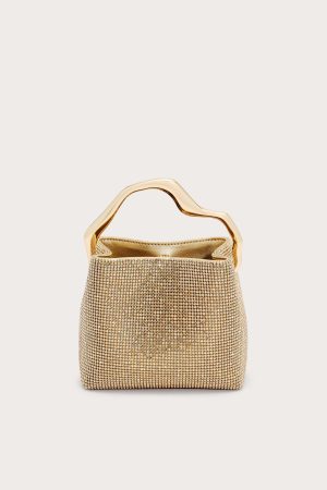 Gold beaded handbag with a sculpted wavy gold handle set against a pale background, centered in the frame (evening bag).