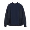 Navy crewneck sweatshirt with oversized fit and layered panel detailing on the sleeves.