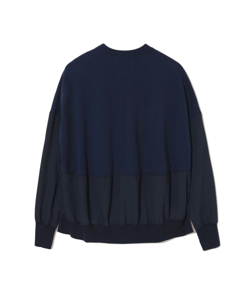 Back view of a navy blue oversized sweatshirt with a gathered ribbed hem and cuffs, loose fit.
