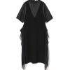 Black midi dress with sheer navy side panels and short puff sleeves, worn on a plain white background.