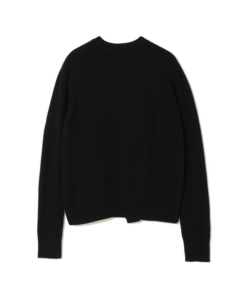 Black knit crewneck sweater with ribbed cuffs and hem on a white background.