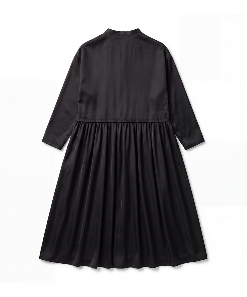 Back view of a black long-sleeve dress with a gathered waist and flowing, full skirt.