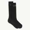Pair of black socks with small white printed numbers near the cuff (top).
