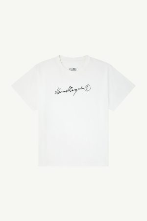 White t-shirt with a black handwritten signature-style print across the chest.