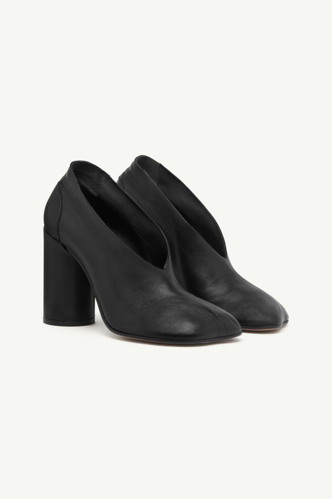 Black leather ankle boots with a chunky block heel and rounded toe