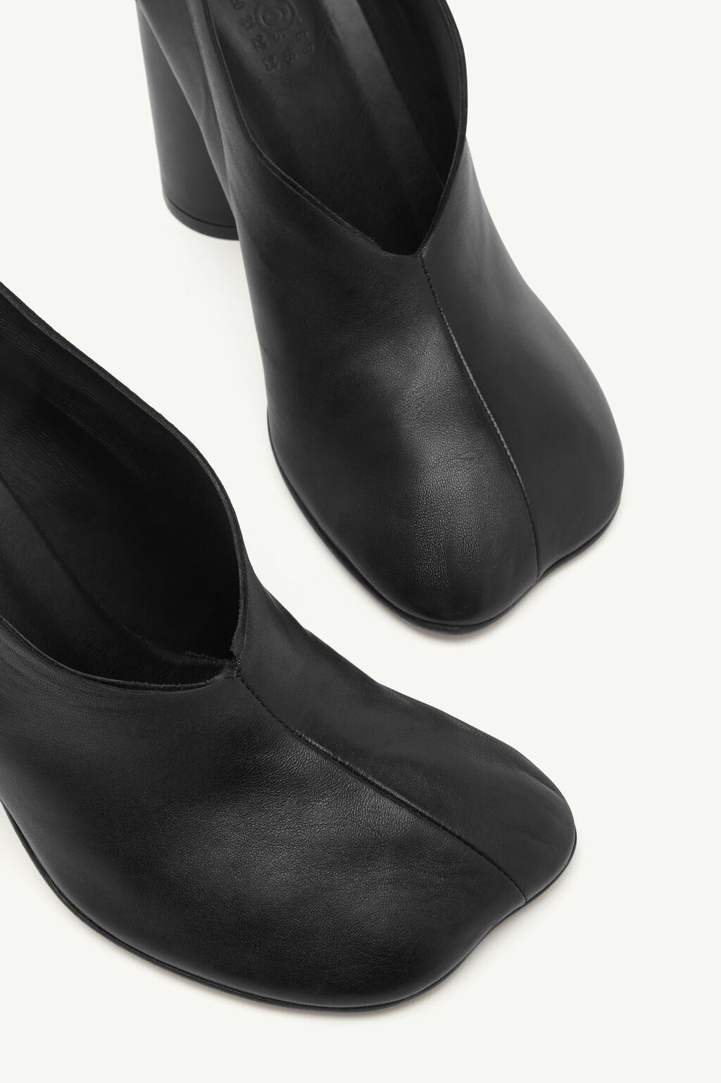 IMG_2967 - New Trend Pair of black leather ankle boots with rounded toes and chunky heels, photographed from above.
