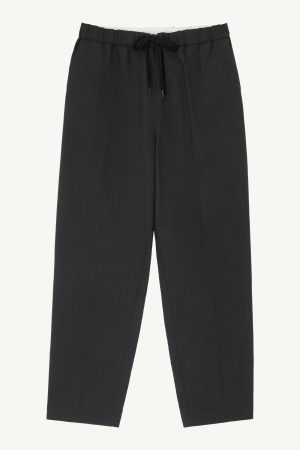 Black drawstring-waist pants with a relaxed fit, shown from the waist to calves.