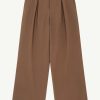 Brown high-waisted wide-leg trousers with front pleats and belt loops, photographed against a light background.