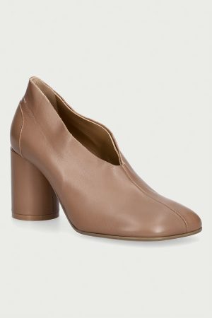 Brown leather ankle boot with a chunky block heel seen from the side against a light background.