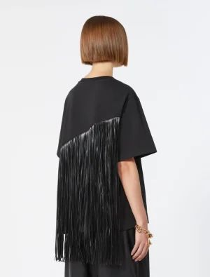 Back view of person in a black oversized top with long black fringe hanging down the back, wearing a gold bracelet and a short bob haircut.