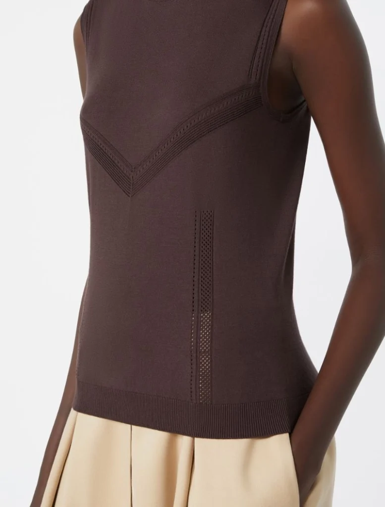 Fitted brown sleeveless knit top with V-shaped perforated panels and ribbed hem, shown on a model