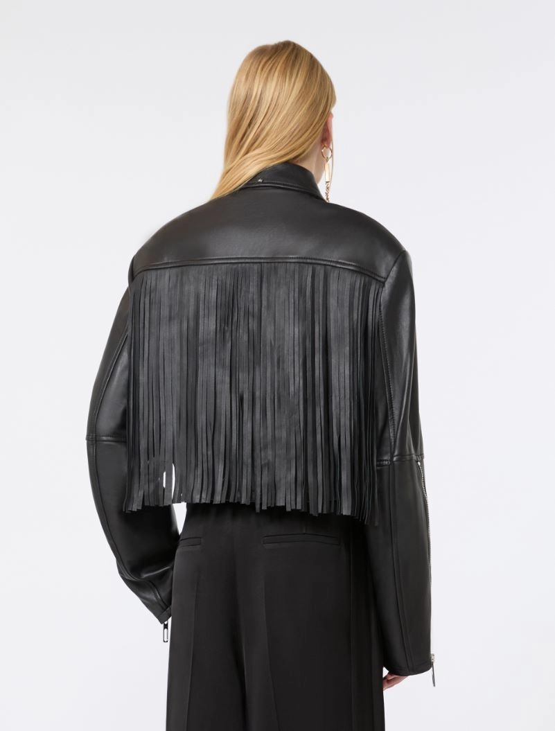 IMG_3049 - New Trend Back view of a person wearing a black leather jacket with long fringe across the back.