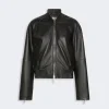 IMG_3088 - New Trend Front view of a black leather bomber jacket with a silver zipper and ribbed collar and hem, on a light background.