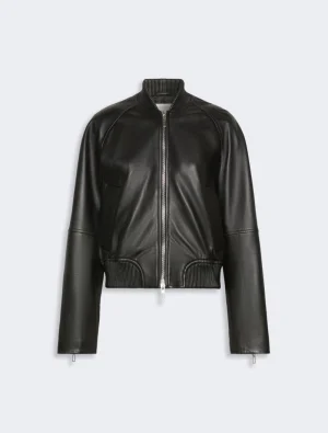 Front view of a black leather bomber jacket with a silver zipper and ribbed collar and hem, on a light background.