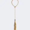 Gold-toned circular chain choker with a long gold tassel pendant