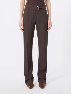 Brown wide-leg tailored trousers with a matching brown belt, worn by a model, full-length view.