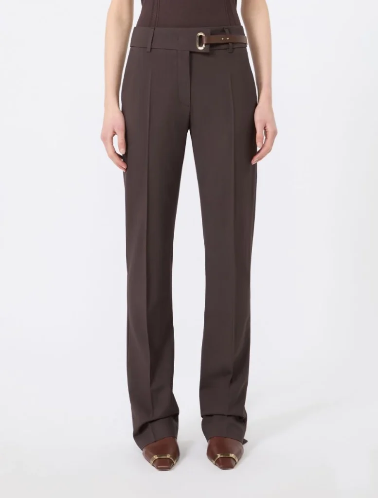 Brown wide-leg tailored trousers with a matching brown belt, worn by a model, full-length view.