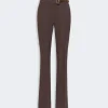 Brown tailored dress pants with a matching belt and gold buckle; straight-leg with a front crease offering a polished look