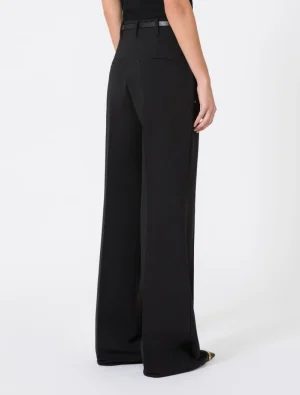 Back view of black wide-leg trousers with a slim belt, featuring two back pockets on a model.
