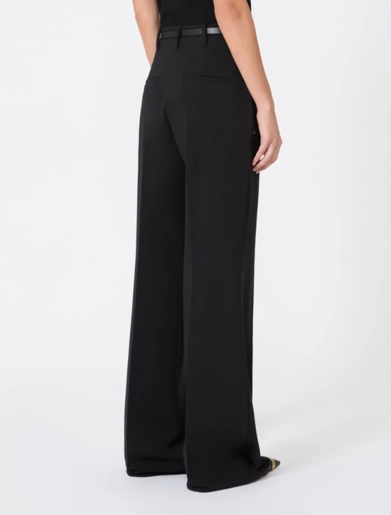 Back view of black wide-leg trousers with a slim belt, featuring two back pockets on a model.