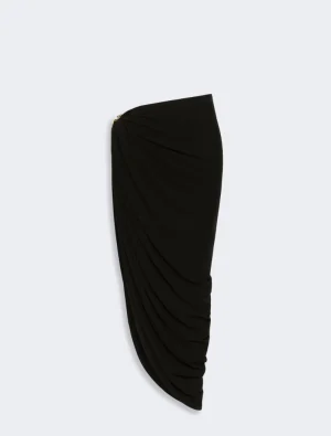 Black draped one-shoulder dress with ruched detailing against a light background