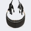 Black crescent-shaped leather handbag with gold hardware and decorative leaf-strap handles