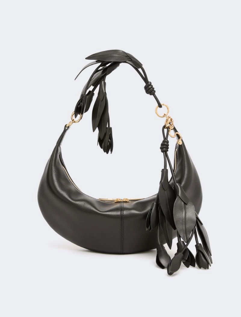IMG_3164 - New Trend Black crescent-shaped leather handbag with gold hardware and dangling tassel fringe beneath the strap.