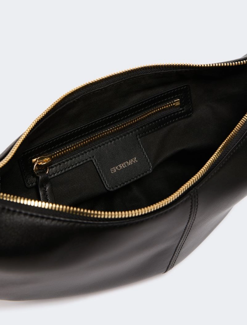 IMG_3166 - New Trend Inside a black leather bag with a gold zip; small zip pocket and SPORTMAX tag on the pocket lining.