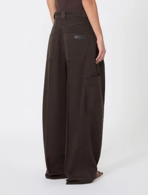 Back view of dark brown wide-leg cargo pants with large rear pockets and a side cargo pocket, worn by a model.