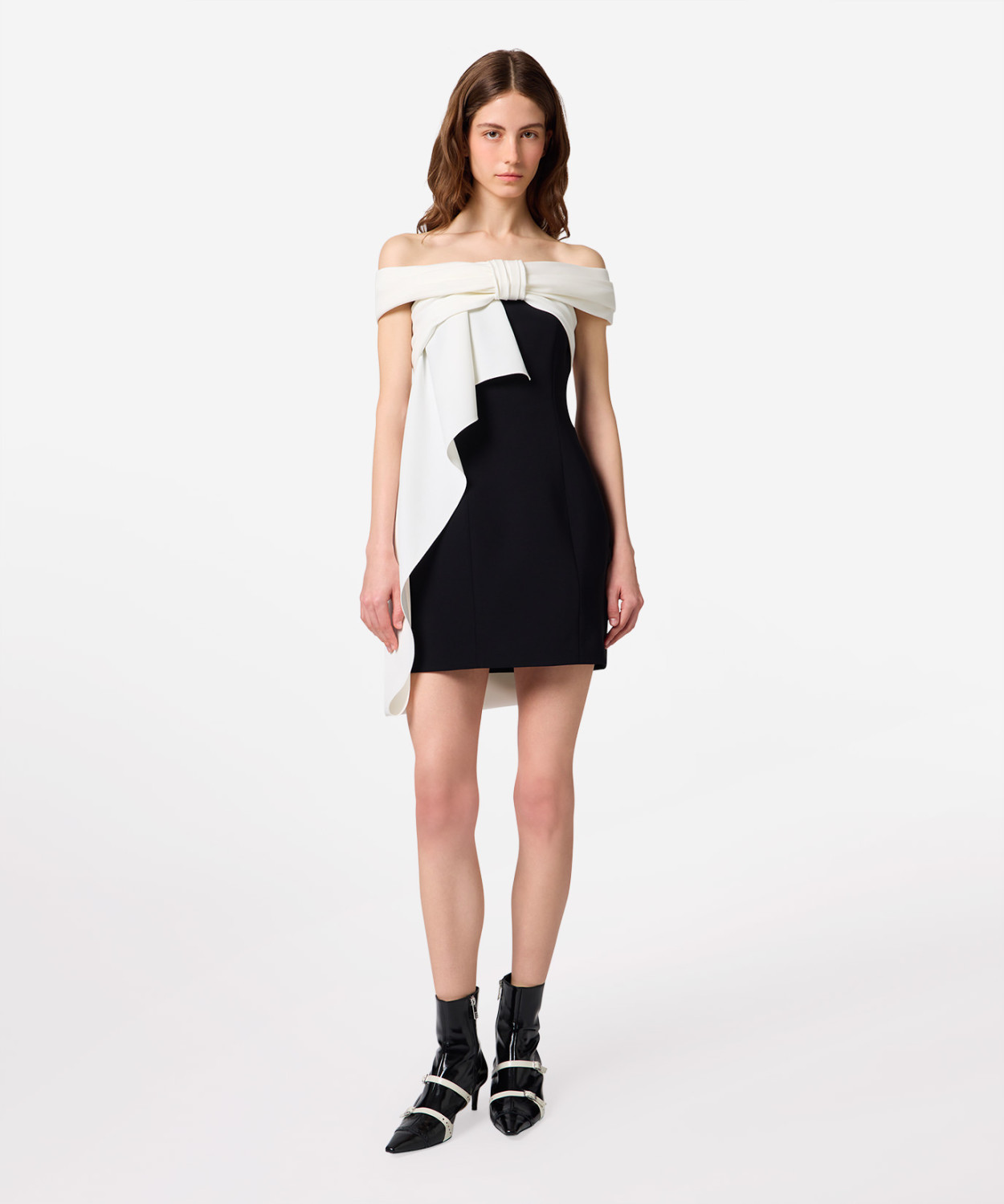 IMG_3188 - New Trend Model in a black off-shoulder mini dress with a white draped scarf tied at the bust and left to hang gracefully across the front.