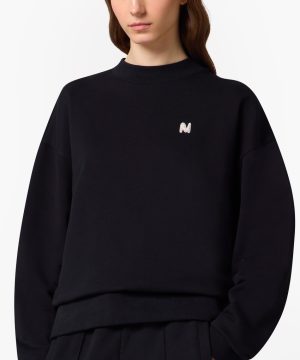 Black sweatshirt with a small white embroidered 'N' logo on the left chest area.