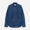 Blue denim button-down shirt with contrast orange stitching and curved hem, long sleeves and a pointed collar (MSGM label visible).