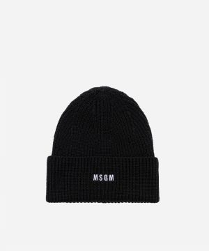 Black knit beanie with folded cuff and white 'MSGM' logo on front.