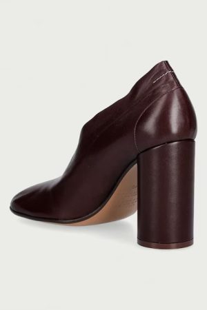 Dark burgundy leather ankle boot with a thick cylindrical heel, side view