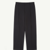Black tailored dress pants with front center creases, belt loops, and side pockets, shown flat against a light background.