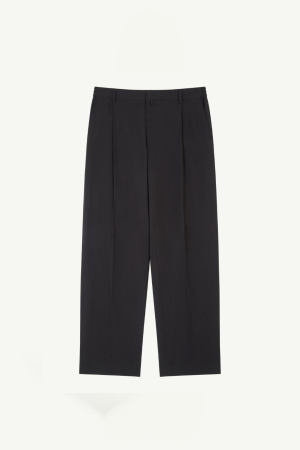 Black tailored dress pants with front center creases, belt loops, and side pockets, shown flat against a light background.
