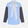 Blue button-down shirt with a large striped neck bow over a light-blue body and plaid sleeves ending in white cuffs for a bold, fashion-forward look.