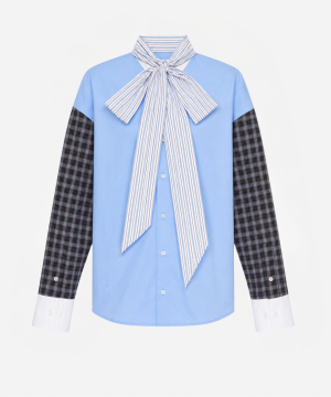 Blue button-down shirt with a large striped neck bow over a light-blue body and plaid sleeves ending in white cuffs for a bold, fashion-forward look.
