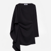 Black one-shoulder draped blouse with a tied knot at the waist, long sleeves, on a plain background (MSGM tag visible inside).