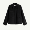 Untitled design - New Trend Black zip-front jacket with a stand collar, single chest zip pocket, and angled side pockets; tag visible on the left sleeve cuff edge for branding.