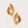 Untitled design - New Trend Gold-painted dried leaves scattered along the bottom of a pale background, forming a delicate cluster