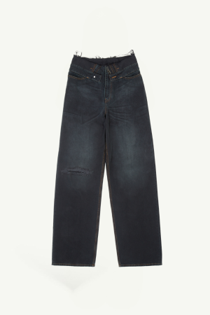 Dark wash denim jeans with a single distressed knee and orange stitching details laid flat on a light background