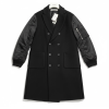 Black double-breasted wool coat with quilted satin sleeves, hanging on a white hanger against a white background, front view shown with multiple buttons and large pockets on the front.