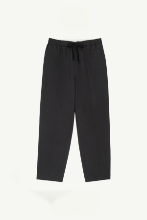 Black relaxed-fit pants with a drawstring waist and straight legs.
