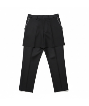 Black layered trouser look: shorts worn over slim pants with zippered pockets on the sides and belt loops