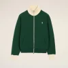 Green zip-up jacket with cream ribbed collar and cuffs, small white heart logo on chest.