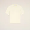 IMG_3459 - New Trend Cream short-sleeve T-shirt laid flat on a pale background with a small heart emblem on the chest and a visible tag at the neckline.