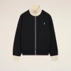 IMG_3470 - New Trend Black zip-front jacket with a cream ribbed collar and cuffs, featuring a small white heart emblem on the left chest
