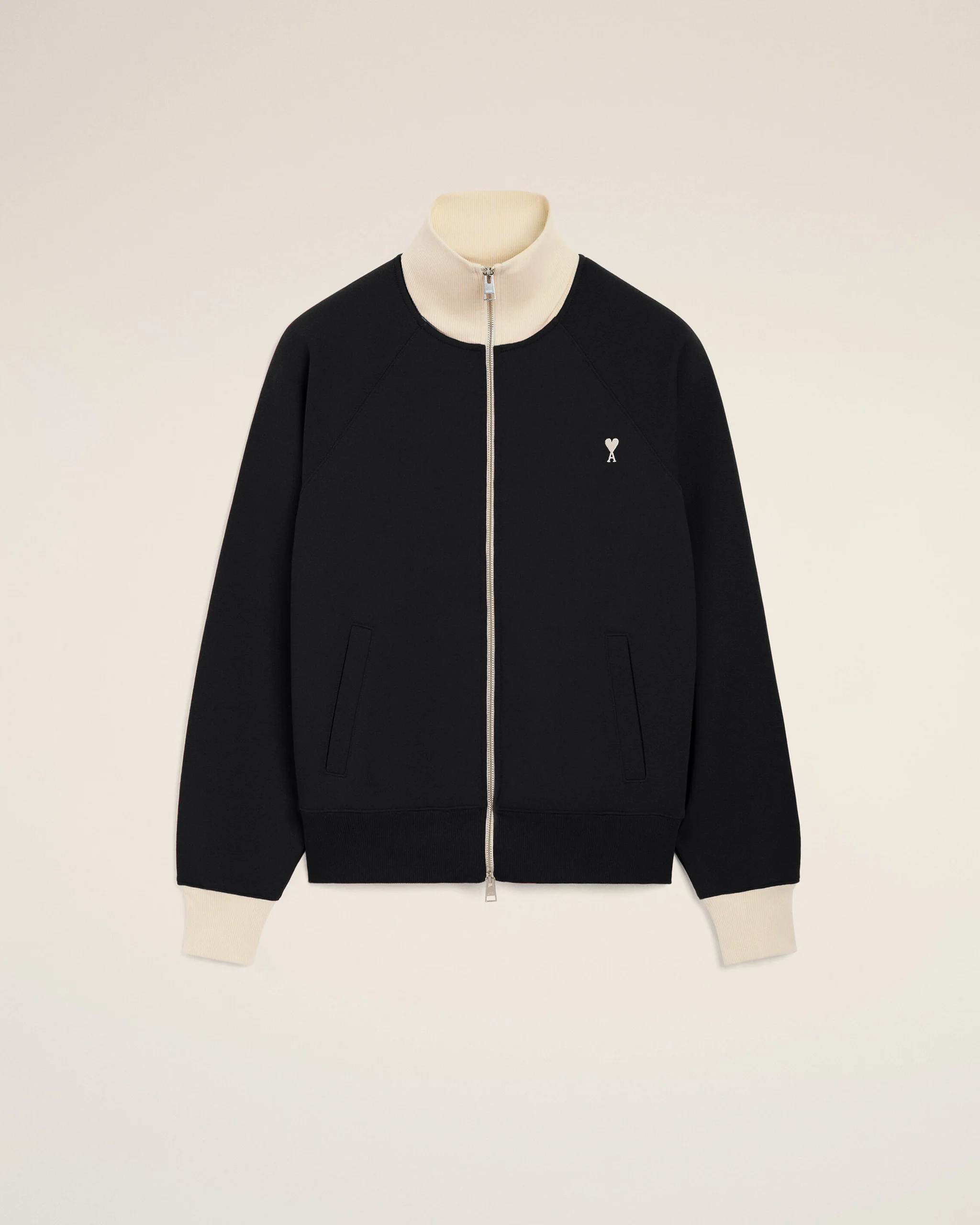 IMG_3470 - New Trend Black zip-front jacket with a cream ribbed collar and cuffs, featuring a small white heart emblem on the left chest