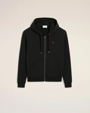 Black zip-up hoodie with a small red heart logo on the left chest, displayed against a light background.